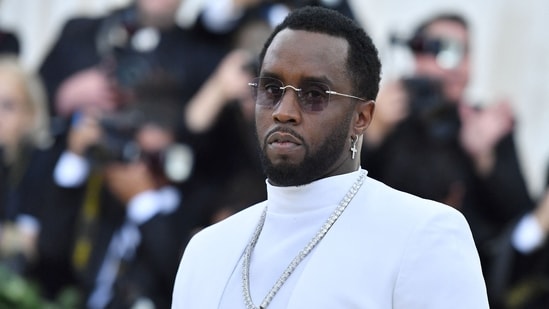 Sean “Diddy” Combs surrounded by headlines reporting on the 120 new sexual assault allegations against him.